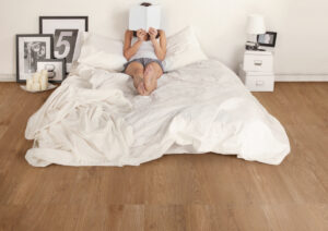 gresie si faianta de calitate | Woman Reading With The Face Covered By The Book Relaxation On The White Bedroom | Gresie Premium